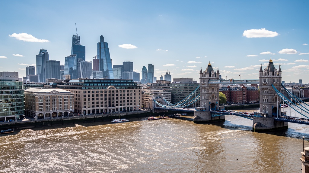 London skyline with Tower Bridge and River Thames, iconic South East England cityscape on a clear blue day