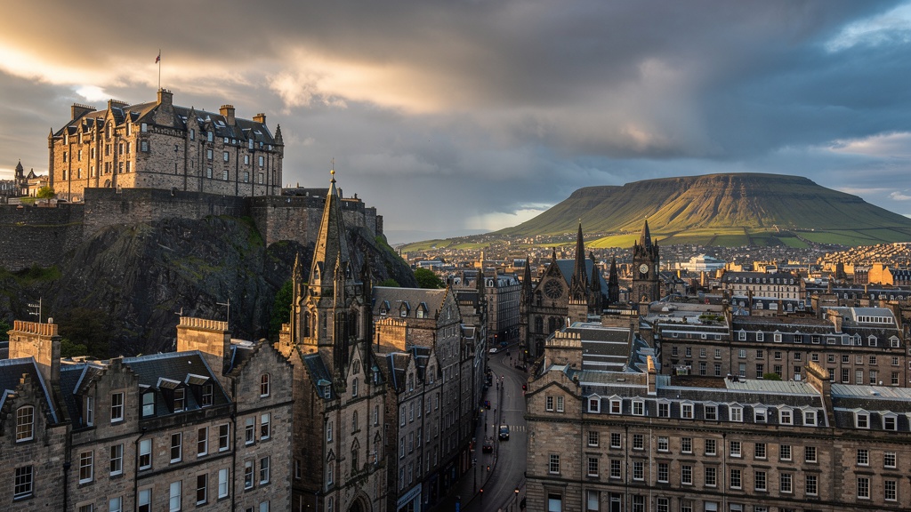 Edinburgh Castle on volcanic rock with Old Town and New Town architecture, Arthur's Seat in the background under dramatic Scottish sky